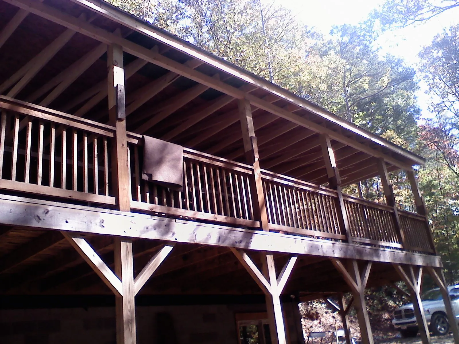Timber framing under a new elevated porch and deck — Roof Leak Repair in Ona by Roofing Brothers